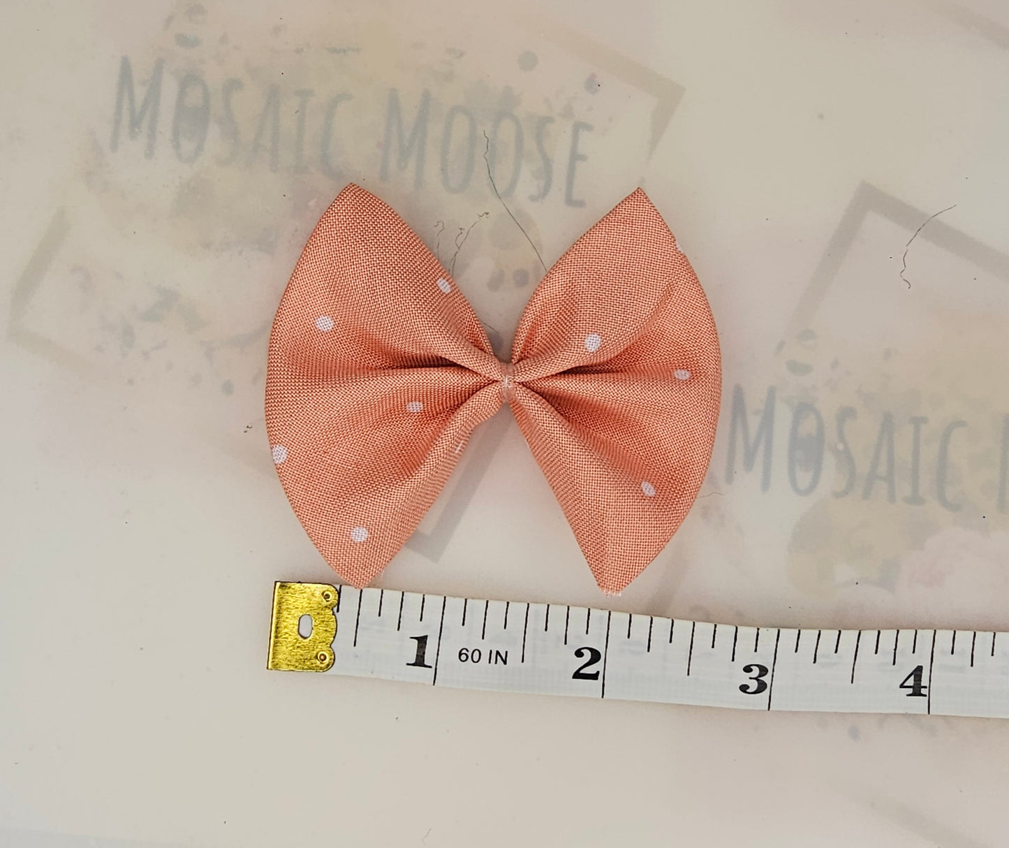 Peachy polkadot print bows