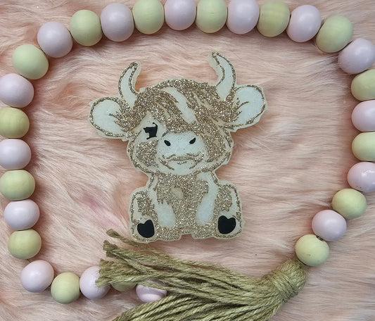 Sitting Highland Cow